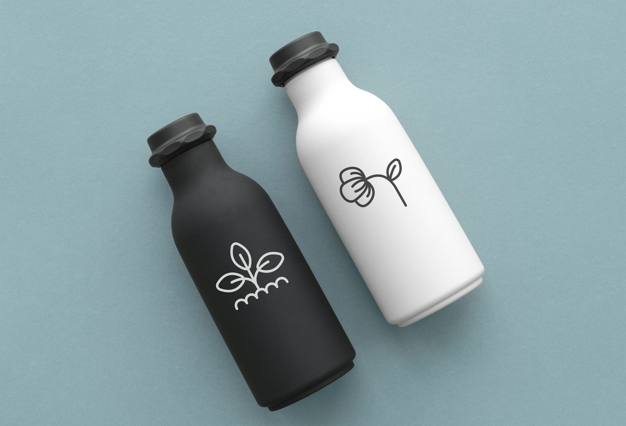 reusable-water-bottles-with-minimal-logo-in-black-and-white-flat-lay.jpg